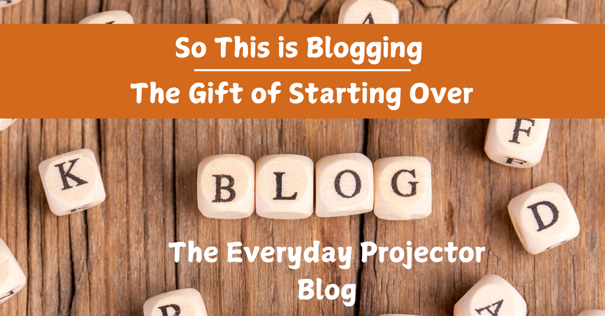 A wooden background with blocks spelling out the word blog in the middle with the title "so this is blogging: the gift of starting over" and "the everyday projector blog" around them